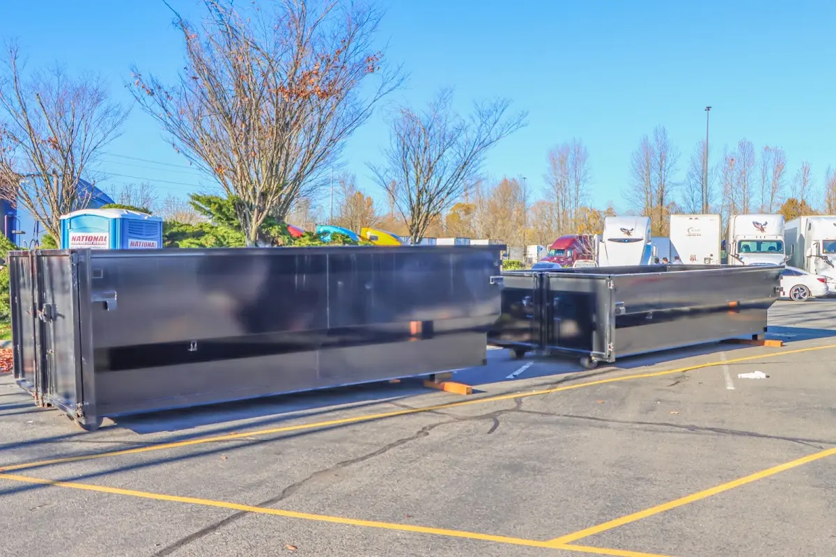 Professional dumpster rental service with roll-off container on residential driveway in Anaheim